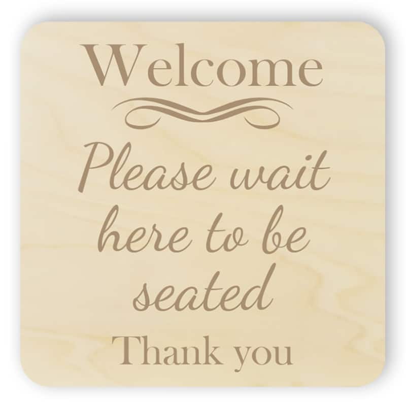Wooden please wait to be seated sign