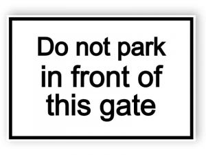 Do not park in front of this sign - white sign