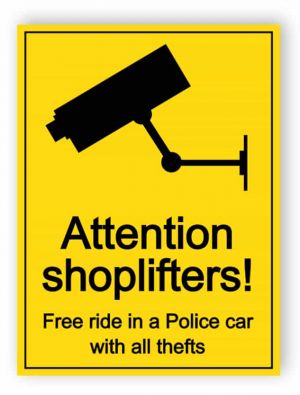 Attention shoplifters - free ride in a police car sign