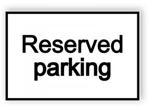 Reserved parking - white sign