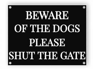 Beware of the dogs - shut the gate - black sign